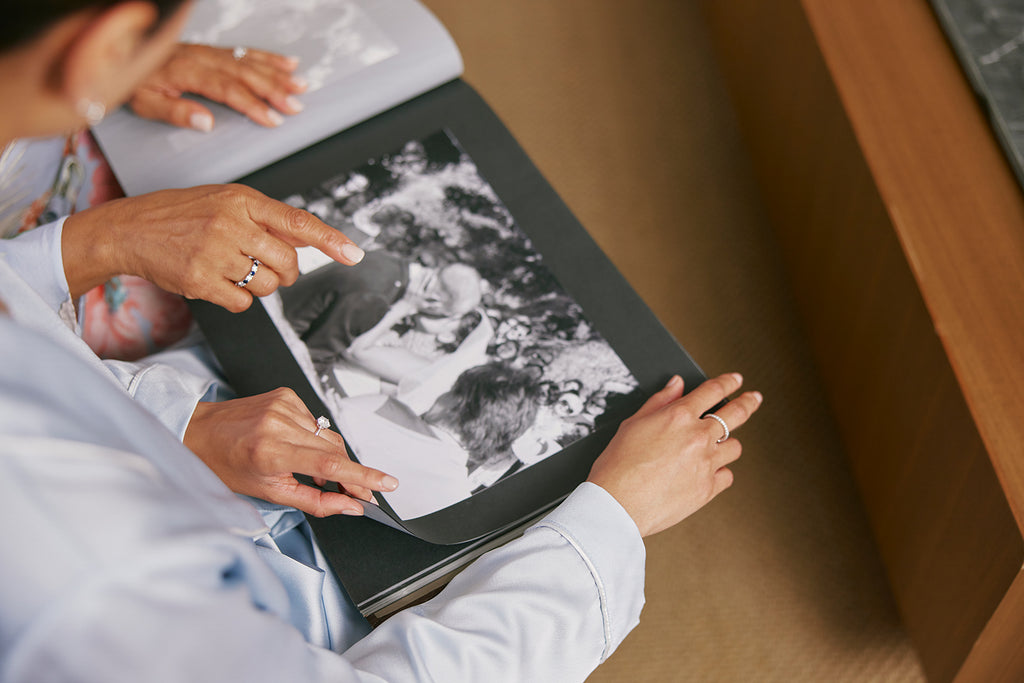 Mother and daughter looking at photo album