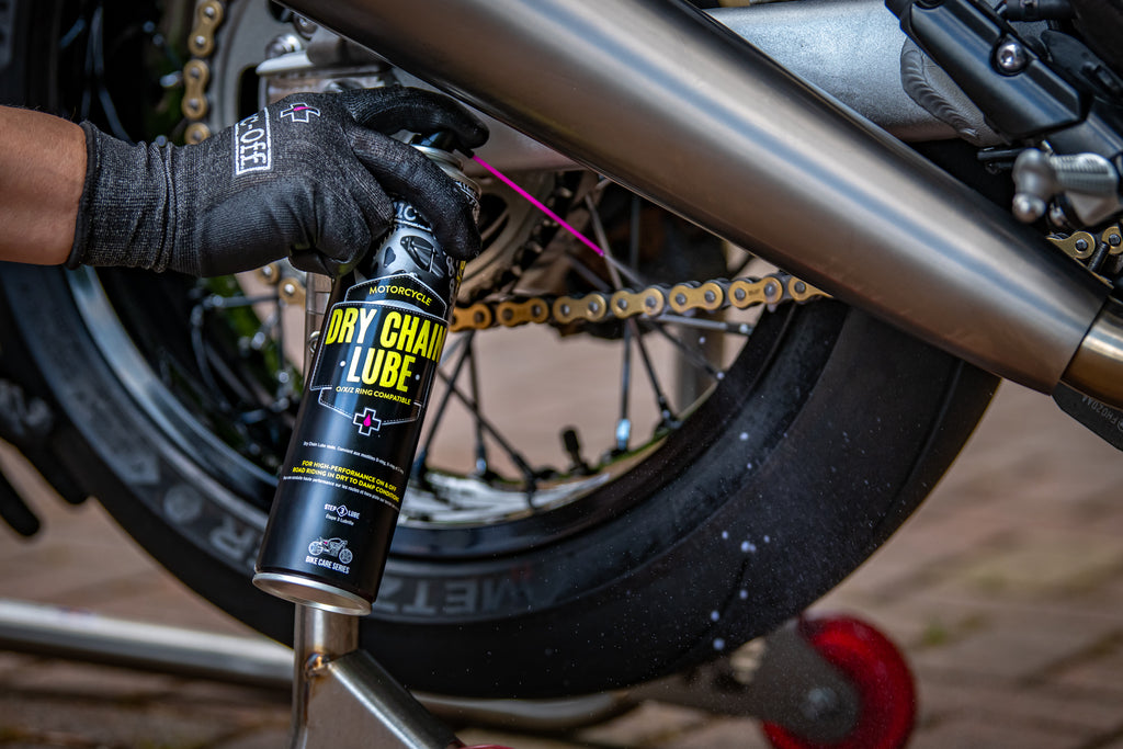 Applying Dry Chain Lube to a motorcycle