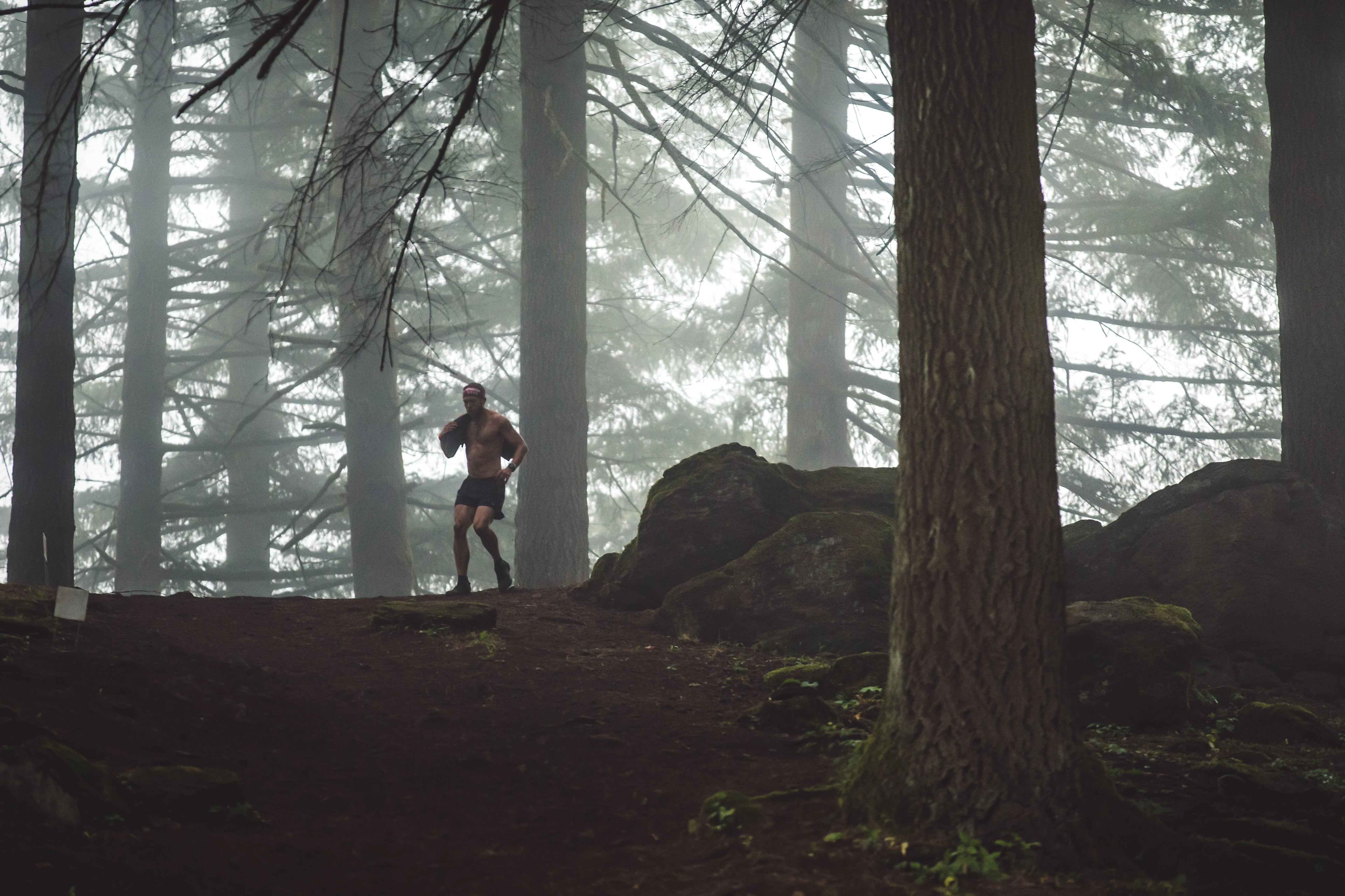 a spartan racer in the woods during a race