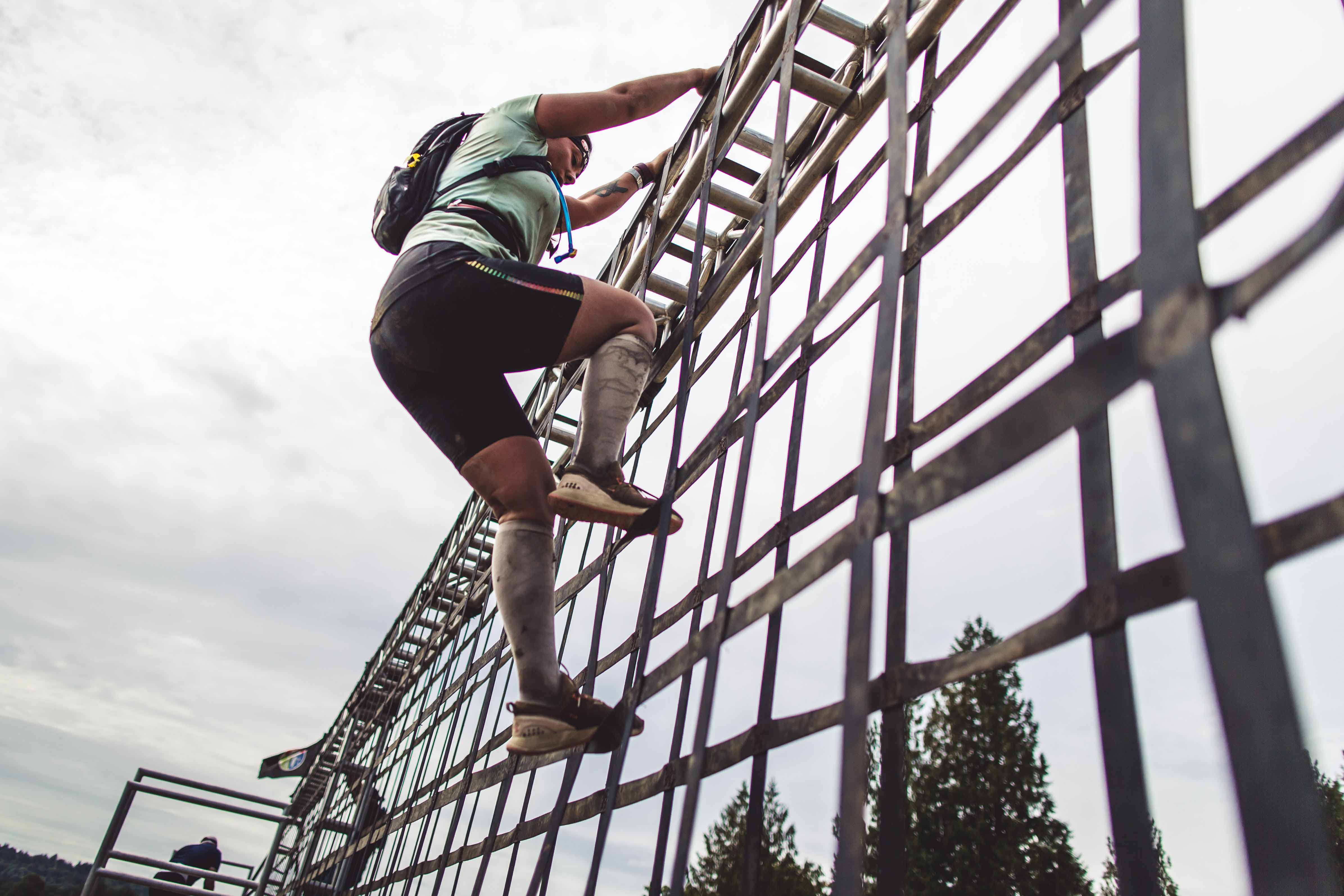 After preparing with ankle stability exercises, a Spartan racer completes an obstacle.