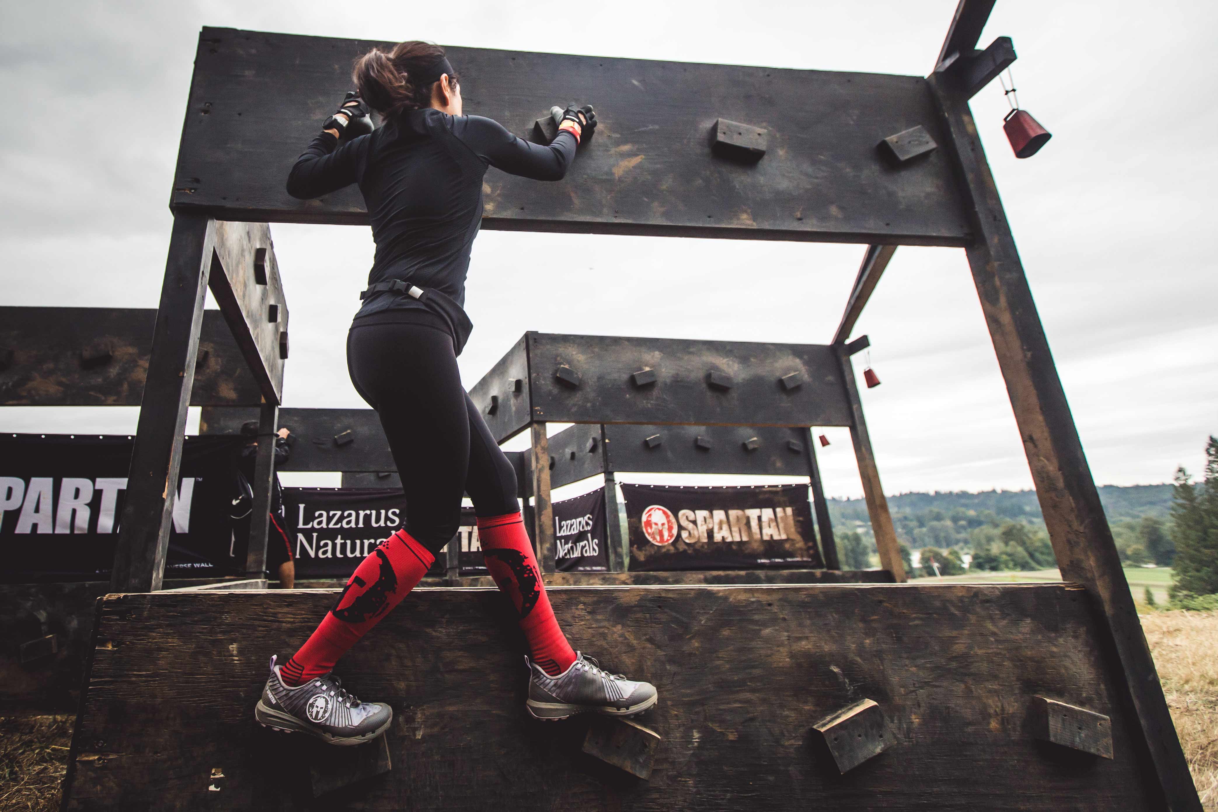 having prepared with ankle stability exercises, a Spartan racer completes an obstacle with no injuries
