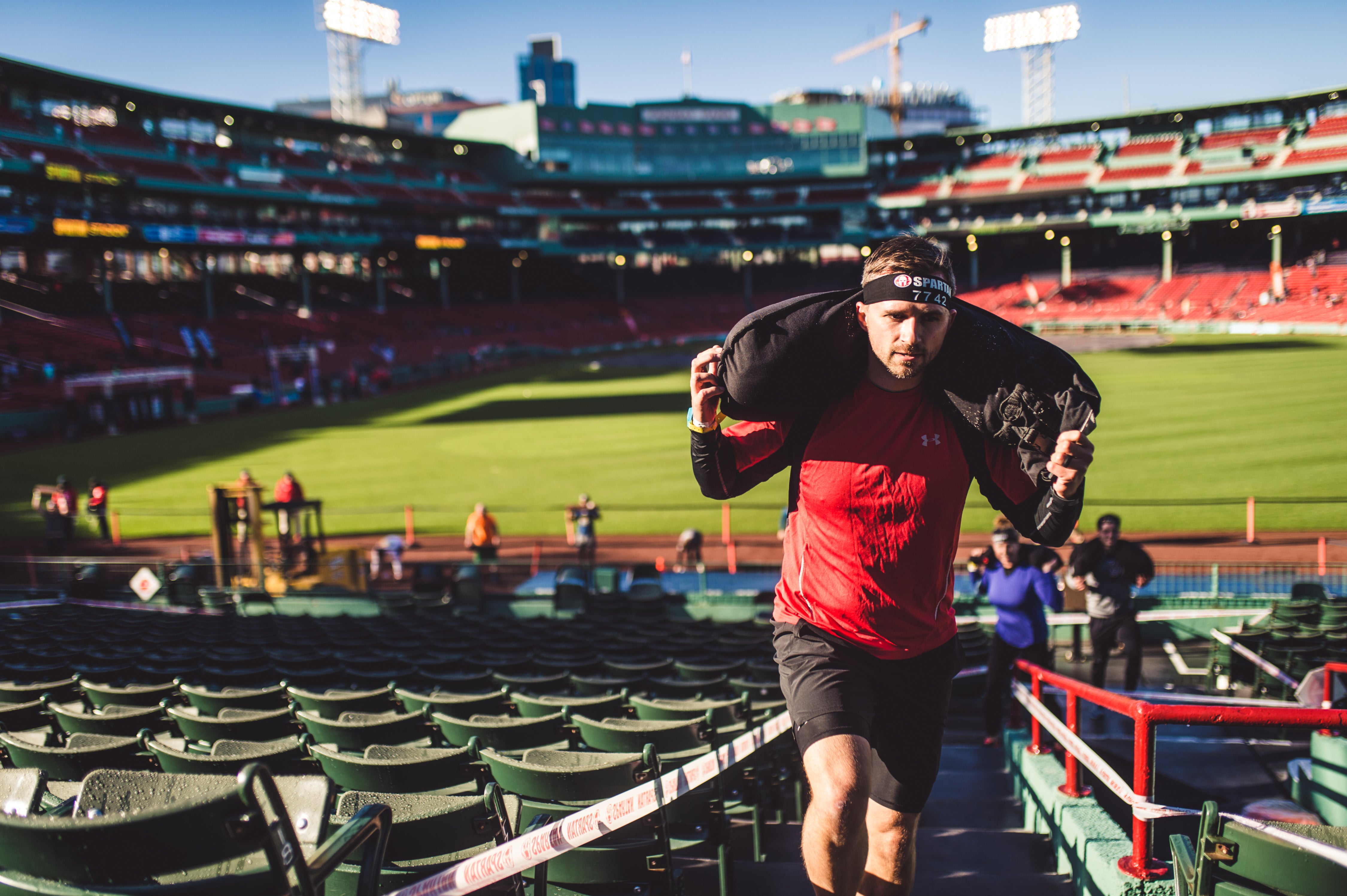 a racer completing a spartan race in november 2022 at fenway park