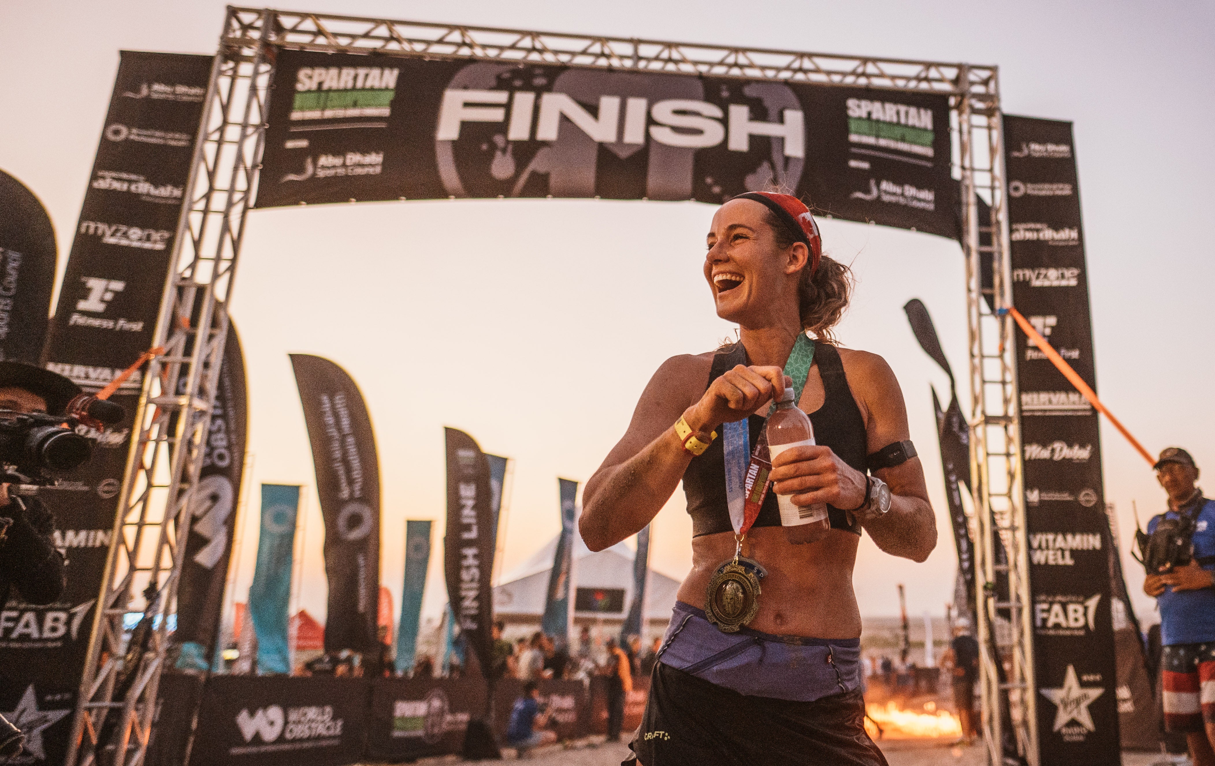 Winner Lindsay Webster crosses the finish line of the 2022 Spartan World Championship in Abu Dhabi