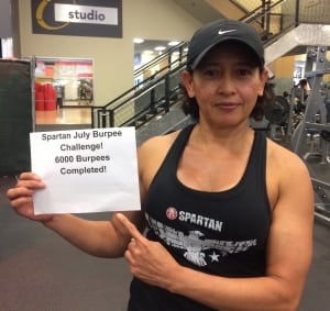 Lupita Almend sharing a paper showing her achieved recorded 6000 burpees