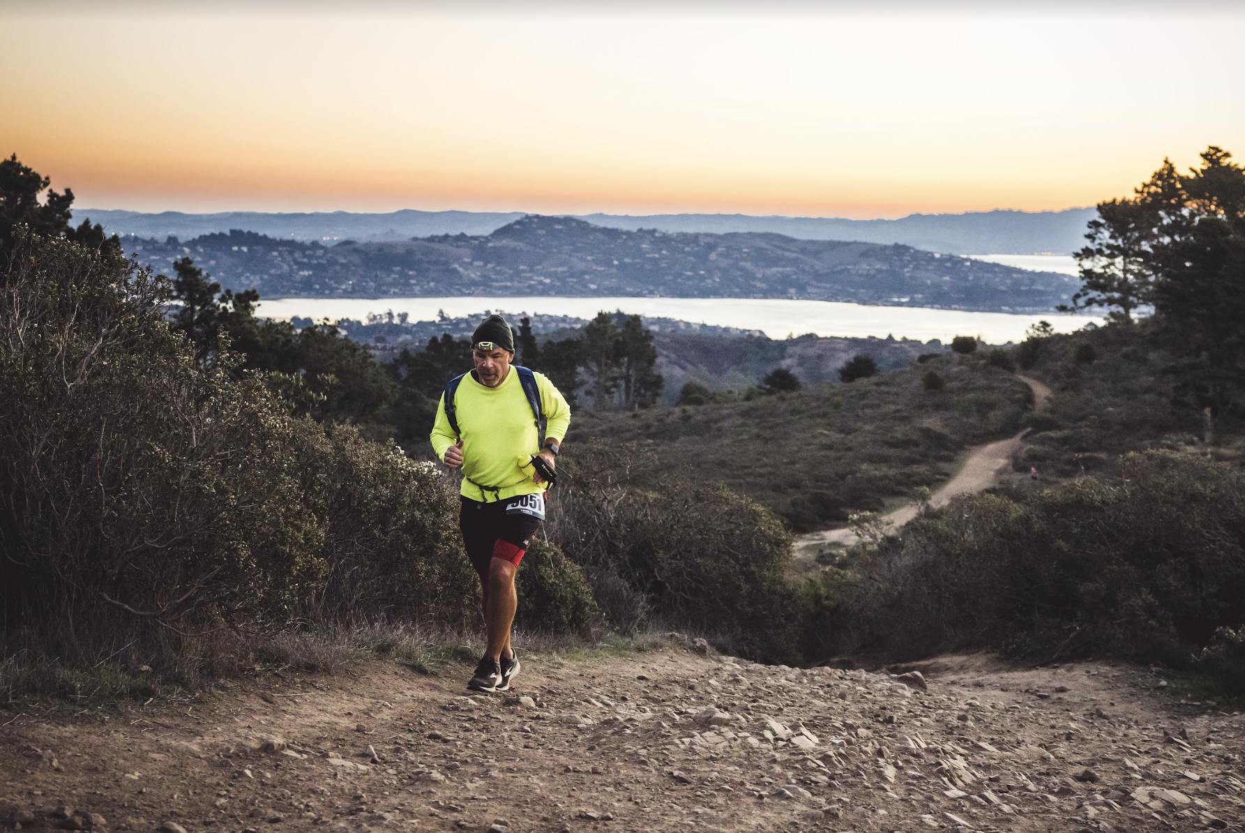 a spartan trail racer running during the golden gate trail classic race