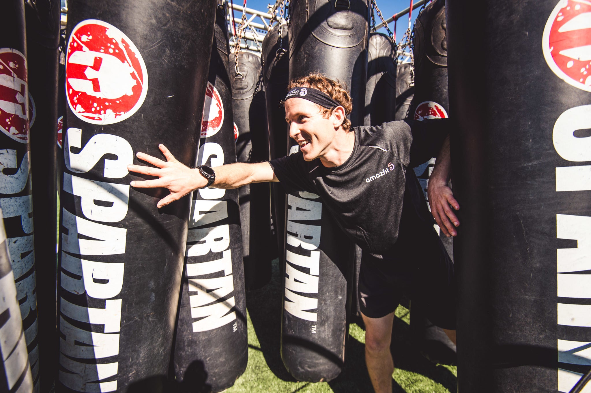 a racer completes a spartan race wearing a Sleep Tracking Sports Watch