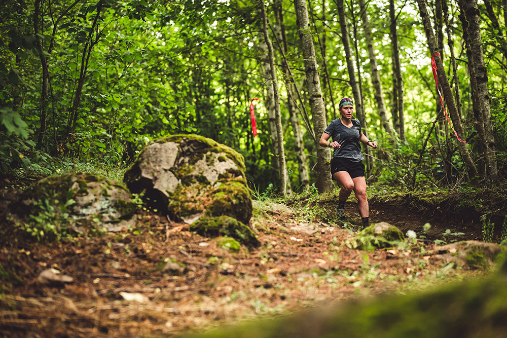 a woman competes in the spartan race in portland