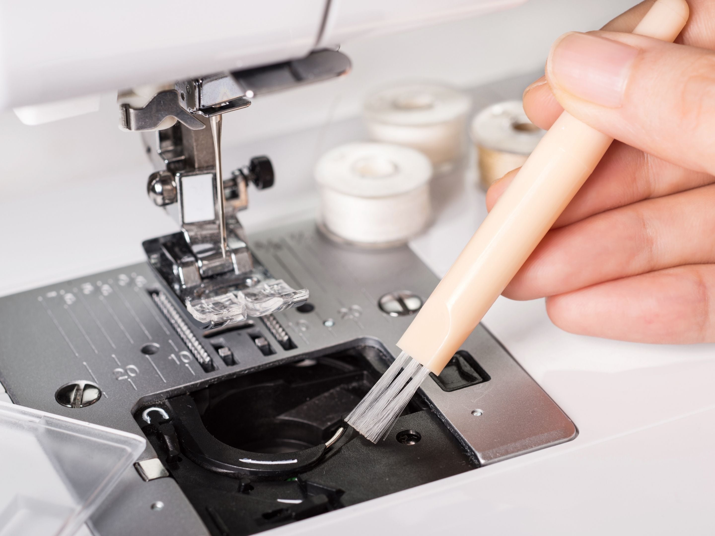 Cleaning Sewing Machine With Nylon Brush