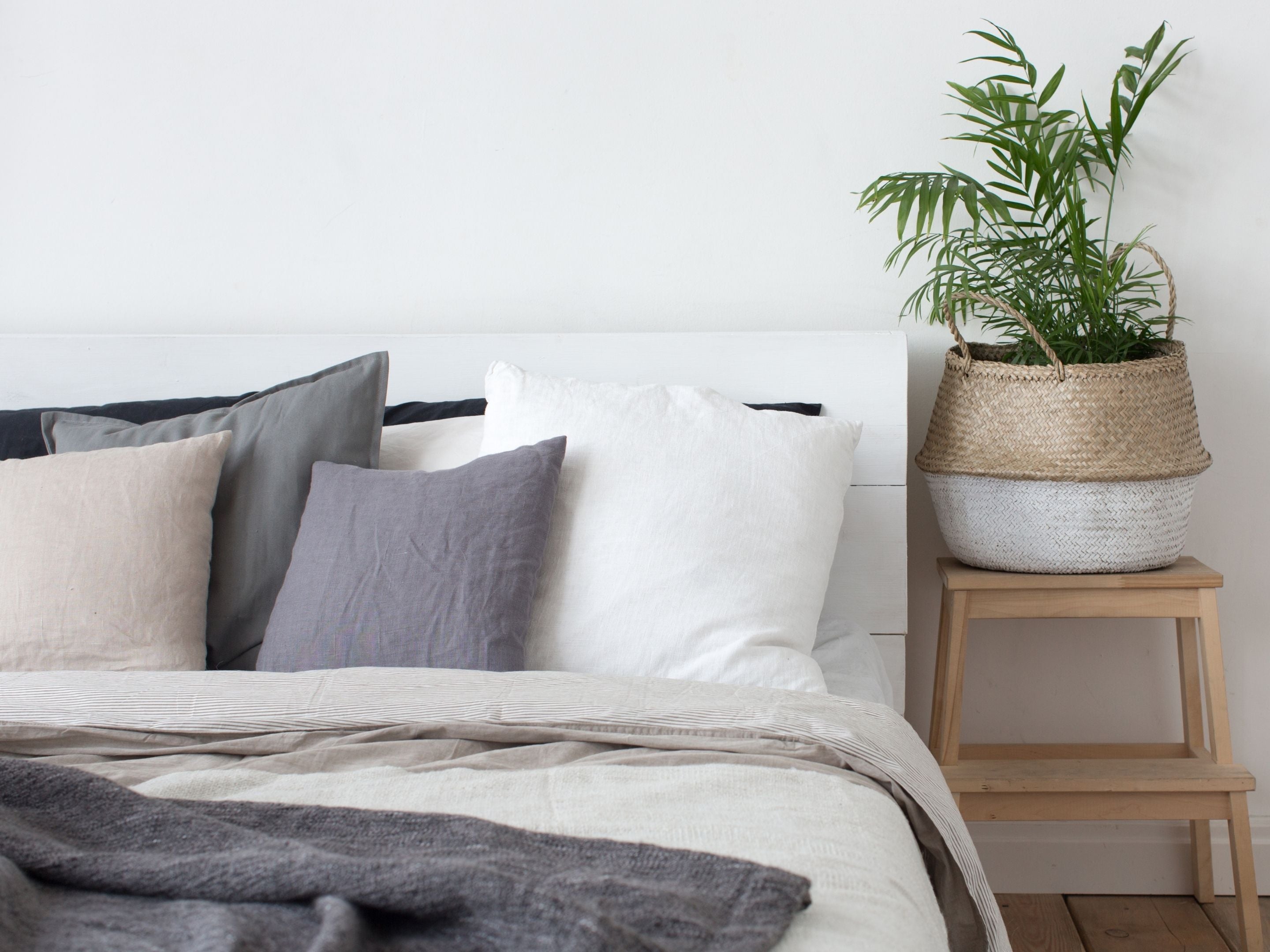 Linen pillowcases and bedding on a made bed