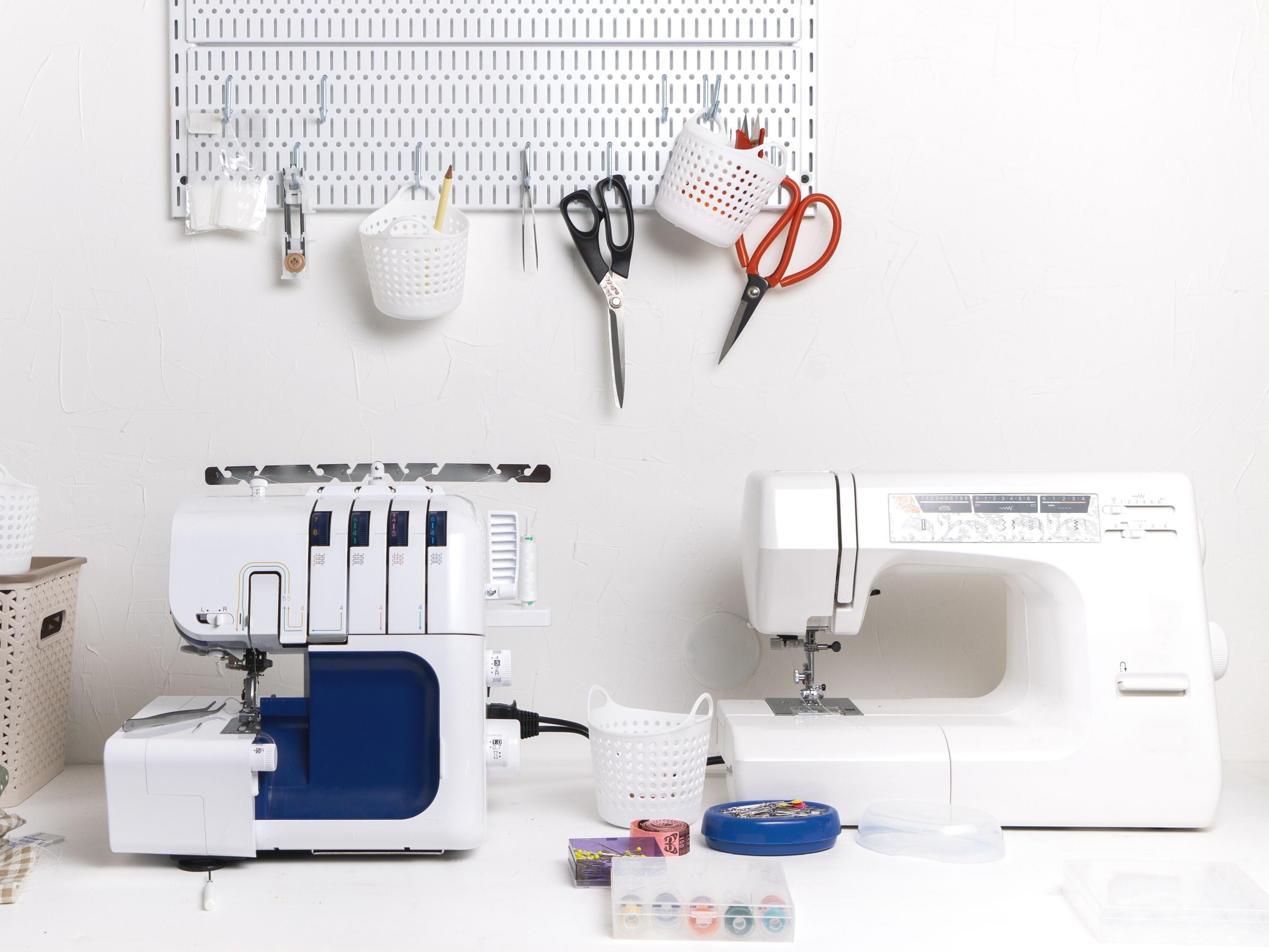 Sewing Space with Sewing Machine and Serger on Table plus Tools