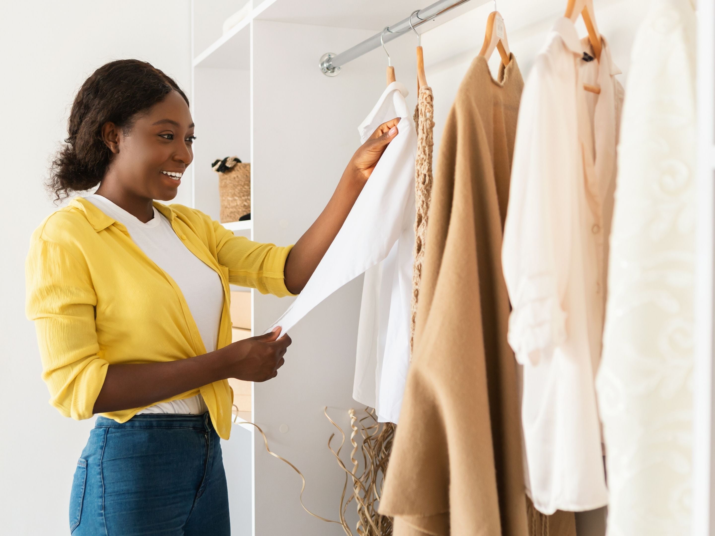 Woman Holding Favorite Garment from Closet