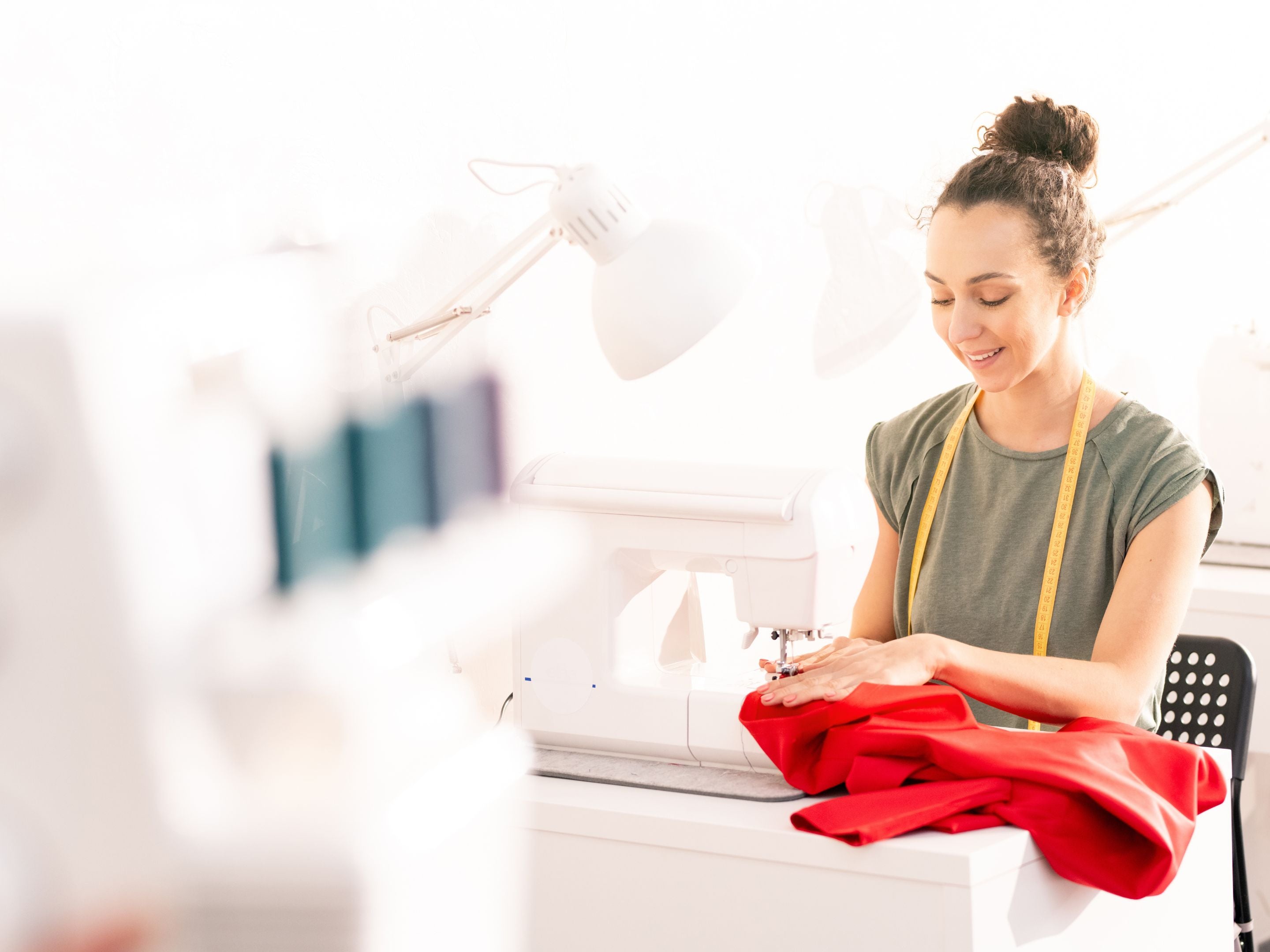 Woman Sewing a Coat