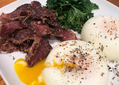 high protein breakfast with eggs, kale and beef biltong