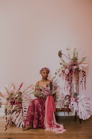 Model with floral installation and voluminous silk ribbon by The Lesser Bear.