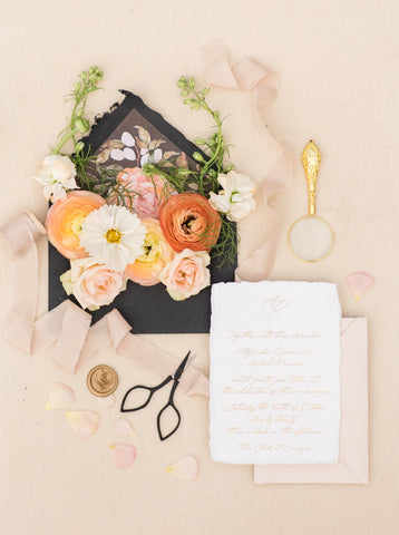 Invitation Flatlay by Starling studio with florals by Prema Designs, Invitations by Lupine Letters, Planning by Jeannene Lillie Events and Ribbon by The Lesser Bear