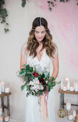 Bridal portrait in front of hand painted pink backdrop  pink silk ribbon by The Lesser Bear