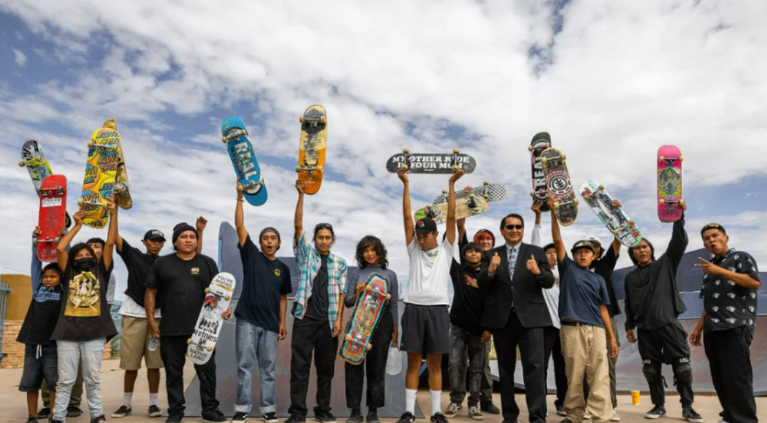 Group of people holding skateboards