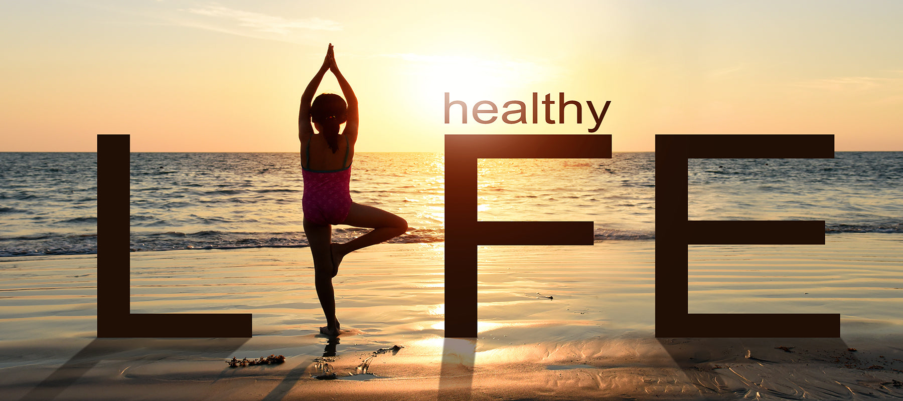 Yoga on the beach with overlay caption says life