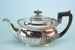 Partially polished silver teapot