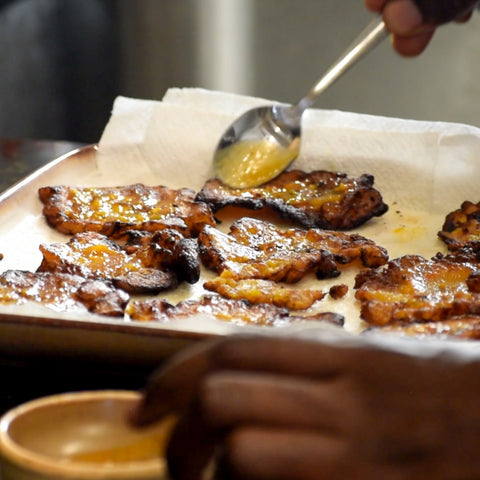 Smashed plantain coated with Trini Pepper Sauce