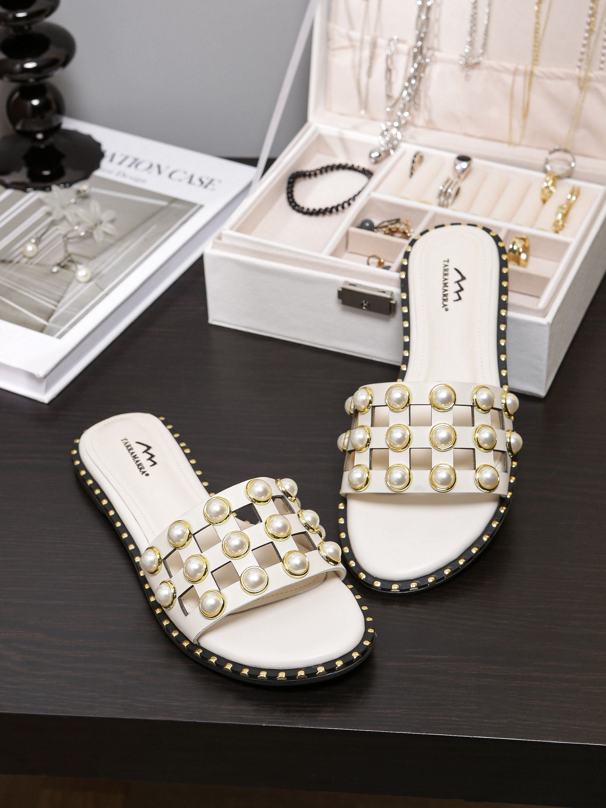 white slides with pearls