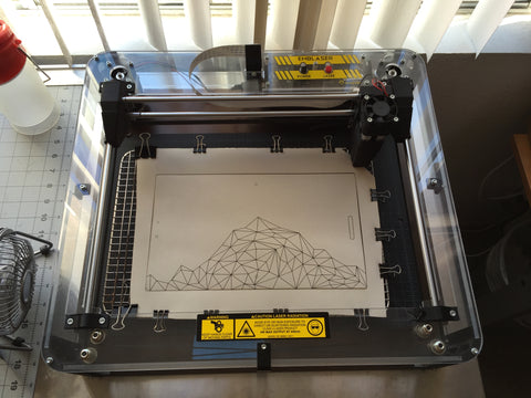 laser cutter with cut leather journal