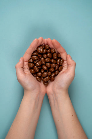 Crunchy peanuts with milk chocolate coating in our popular Chocolate Nuts