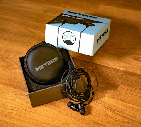Unboxed Meters M-Ears showing the wired headphones and case