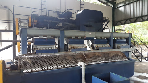 De-pulping machine that acts like a cylinder grater to separate the fruit from the “beans” in a washed process.