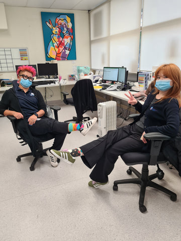 A woman wearing funky socks in an office