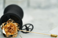 A product image of the rose gold rose shaped flower lapel hat pin by Dear Martian, Brooklyn
