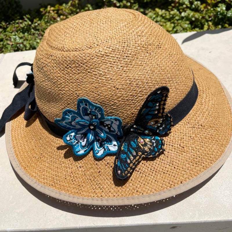 Linda decorated her Classic tan Straw Hat Bike Helmet with a butterfly