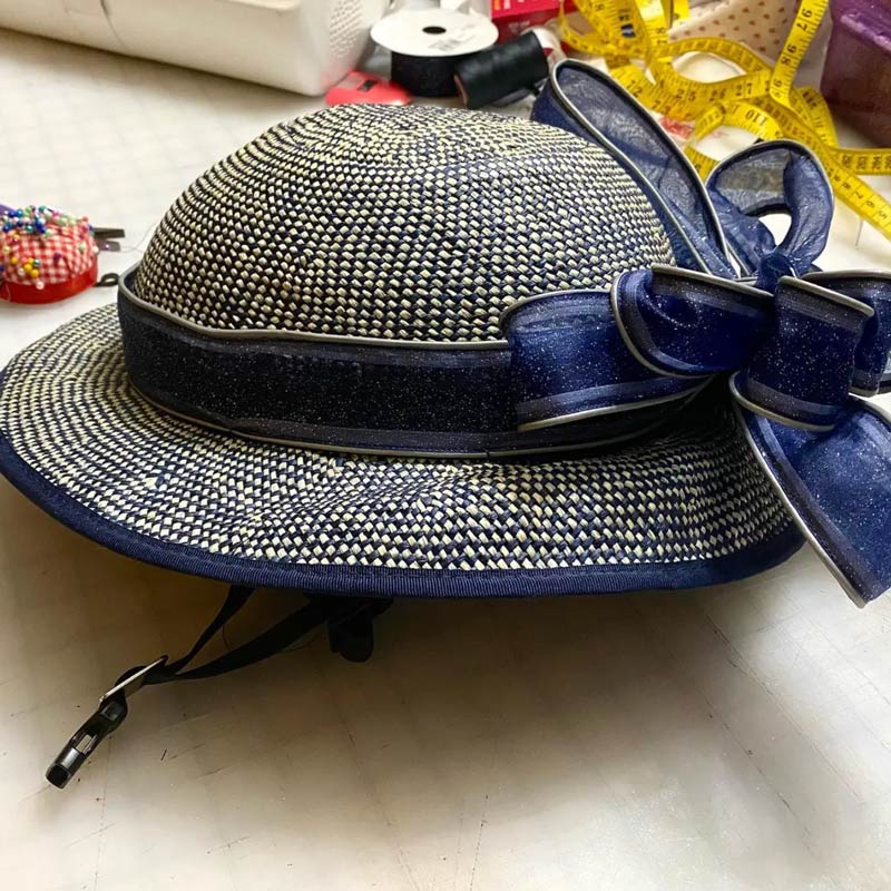 Plakapaint decorated her Shibori Blue Straw Hat Bike Helmet with retro-reflective ribbon