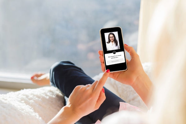 Blonde woman looking at her phone