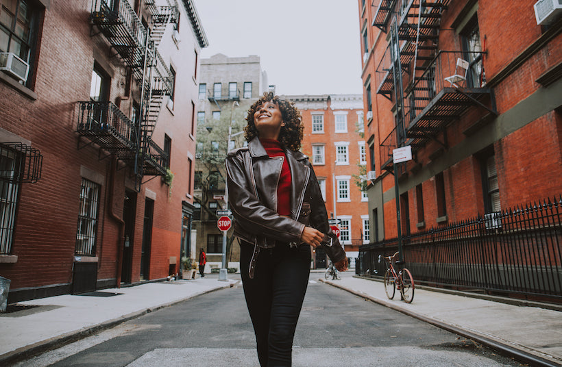 Beautiful girl walking in New York City freely and happy. 