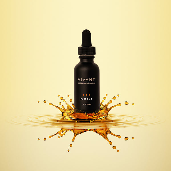 Vivant's antioxidant serum Pure C+E coming out of an amber puddle. 