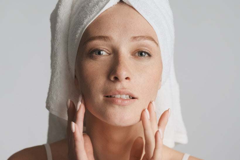 Close up girl with smooth skin and towel on head