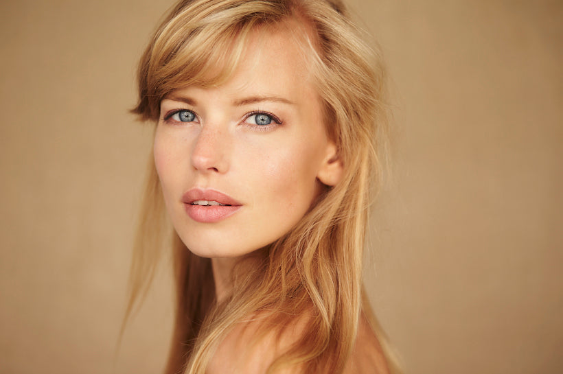 Blonde and blue eyed woman, studio photo