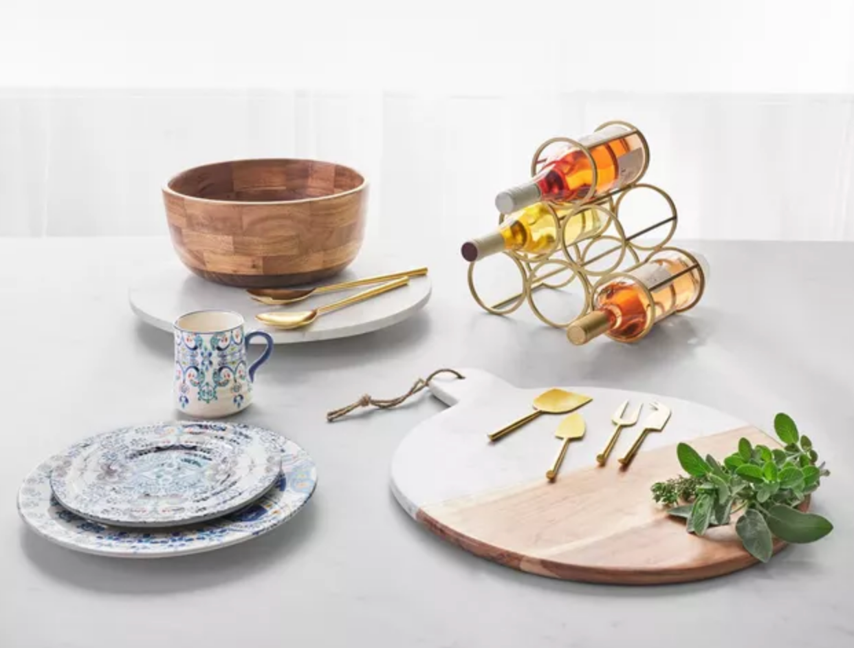 dinnerware on a table with a wine rack