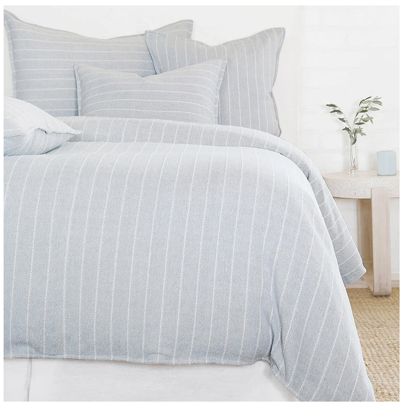 Cozy bed with blue and white stripes