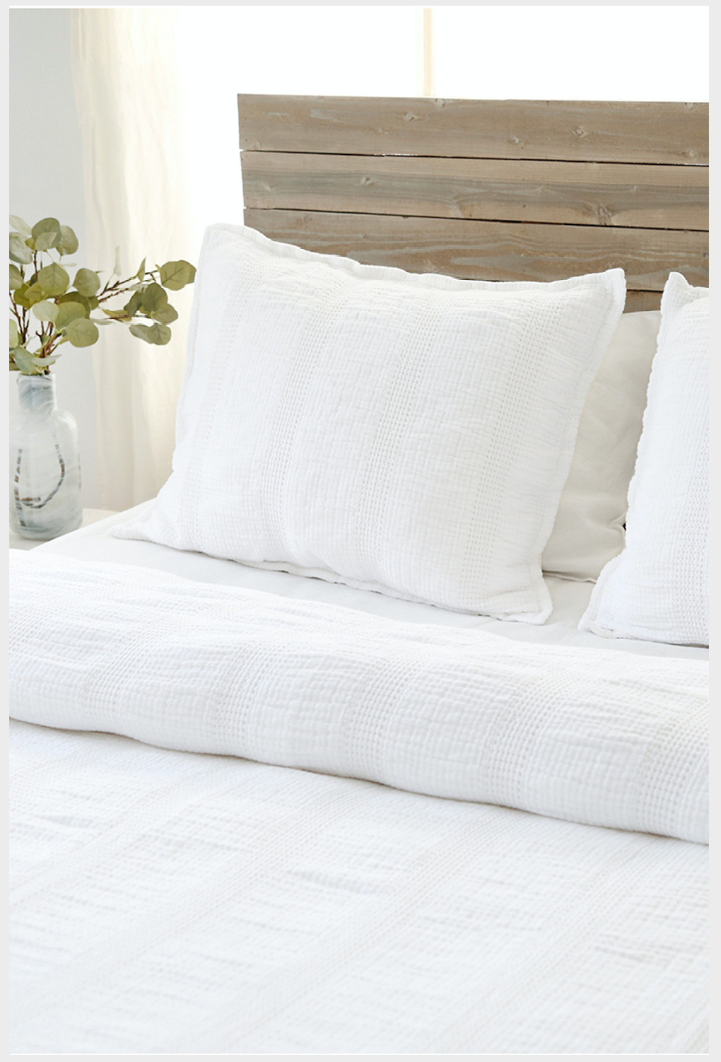 soft knit white bedding on a bed