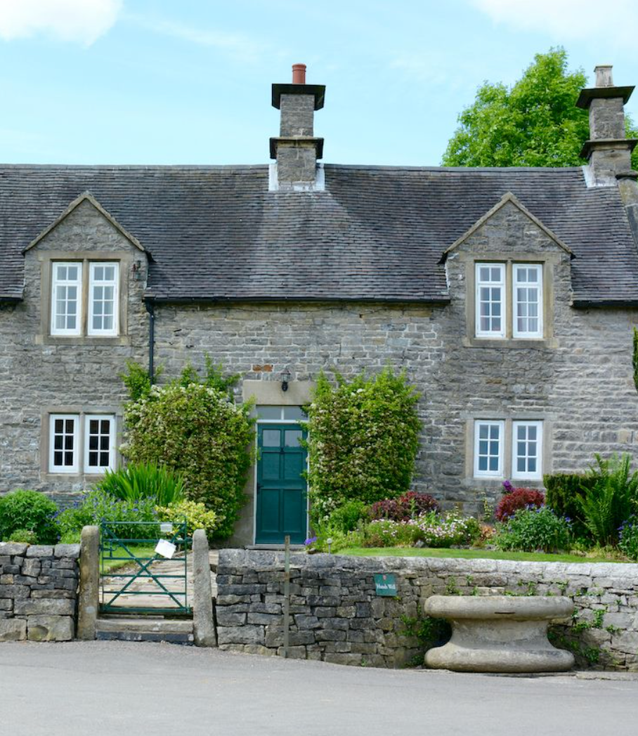 a very old quaint home made from stone