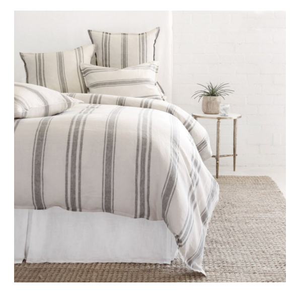 linen bedding on bed, striped grey blue on flax background,  duvet and four pillows