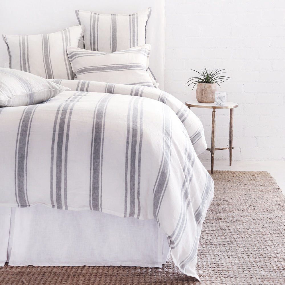 Striped linen bedding on a bed