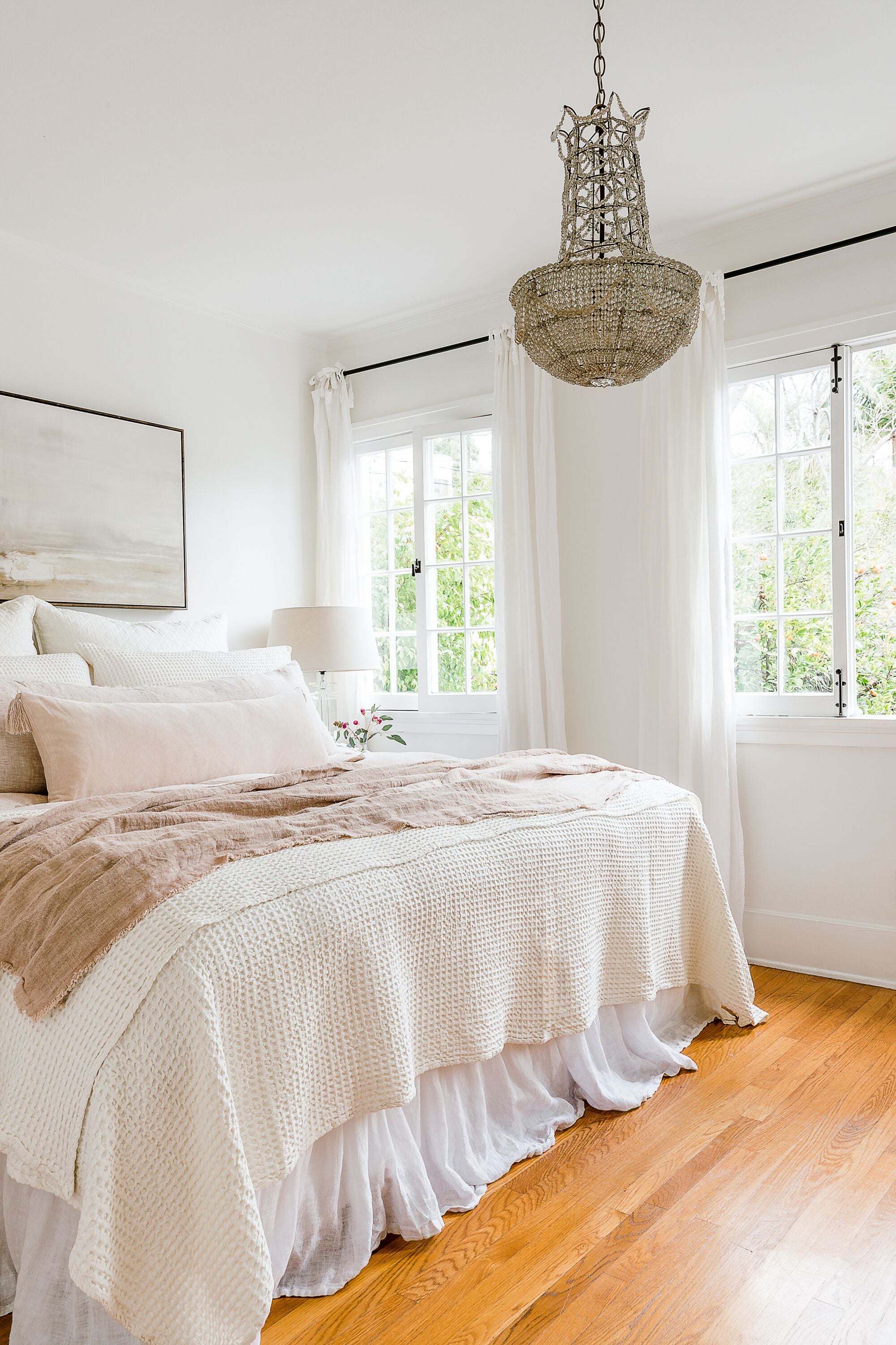 beautiful master bedroom with chandelier