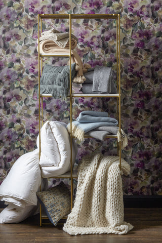 gold shelves with bedding on it