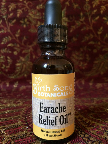 Earache relief oil with garlic and mullein flowers