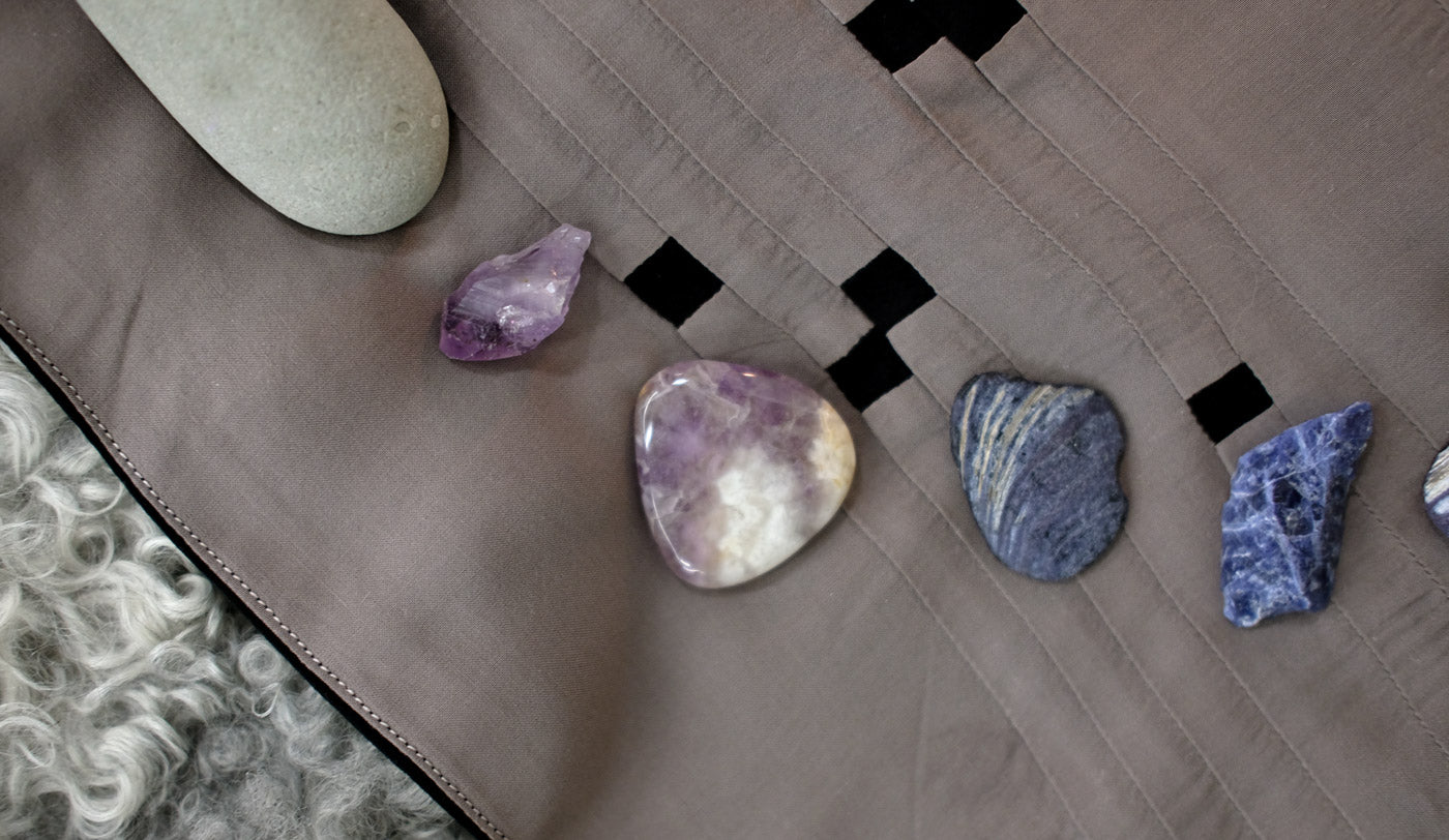 Taupe side of the Constellations Tarot Cloth with stones