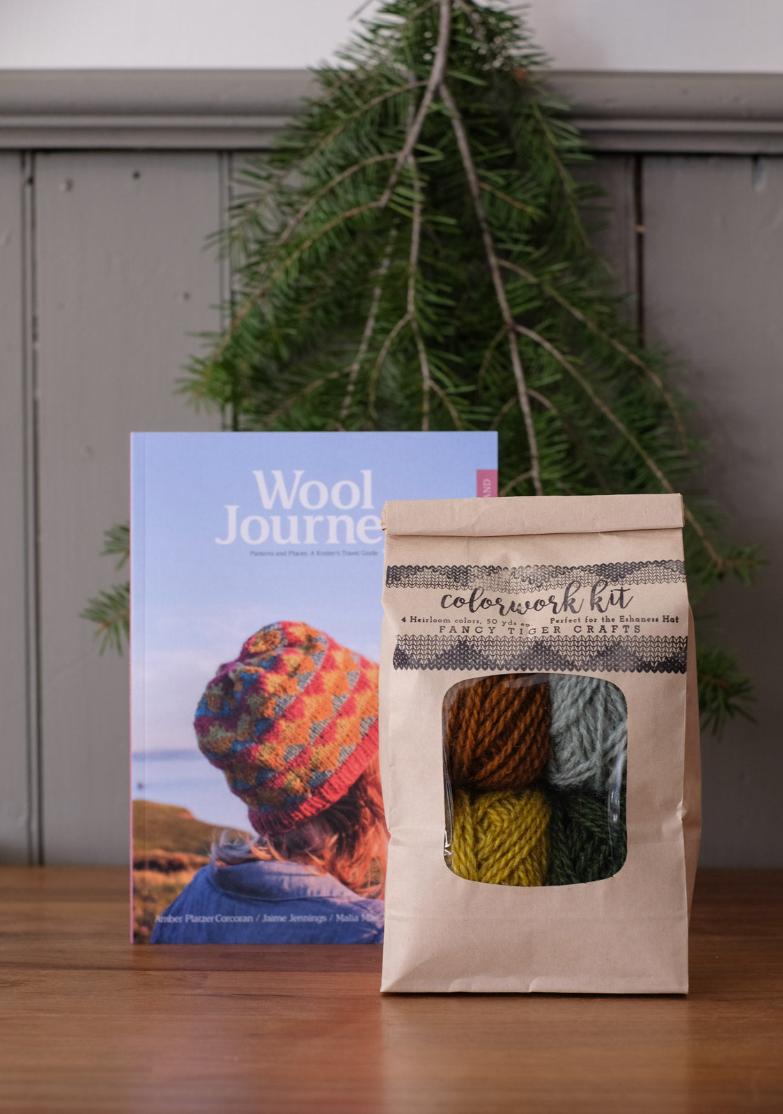 An Eshaness hat kit sitting in front of the Wool Journey: Shetland Book
