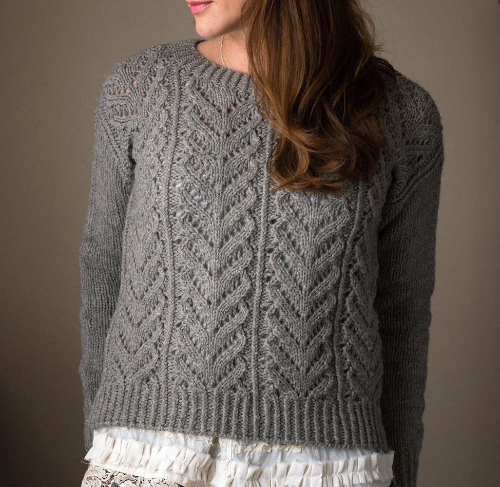 Close up of Wolf River sweater, a chunky lace sweater in grey wool